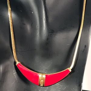 Unmarked gold tone chain 16” red enamel in the center with  stones in the center